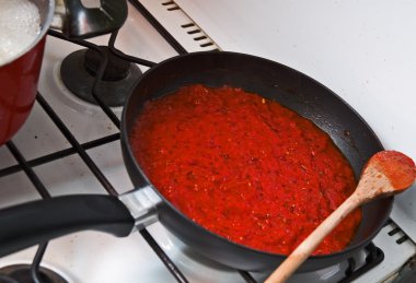 Pan with tomato sauce clipart