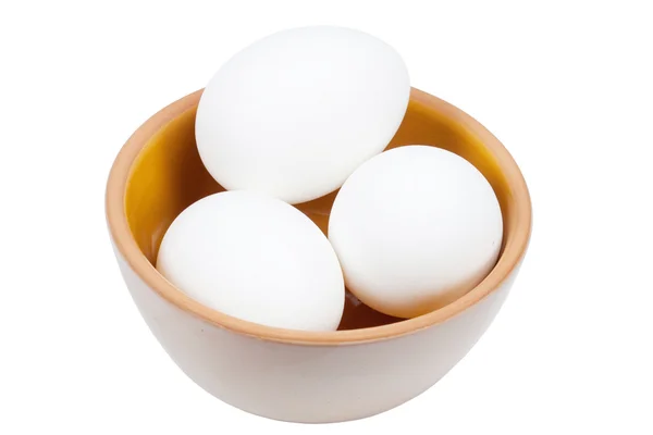 Três ovos em uma chapa — Fotografia de Stock