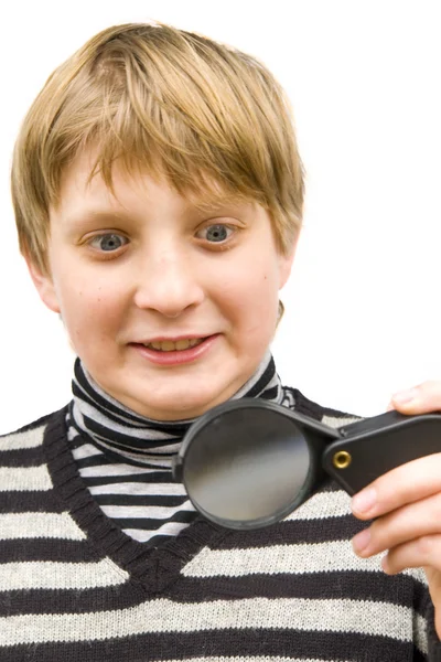 A boy and a magnifying glass — Stock Photo, Image