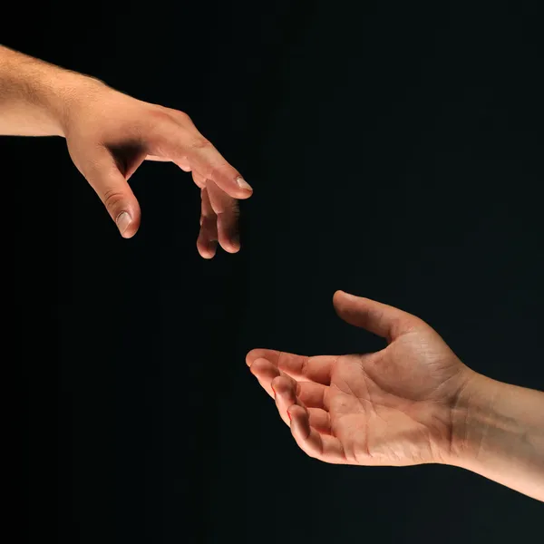 Two hands reaching to each other — Stock Photo, Image