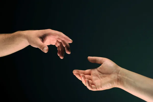 Two hands reaching to each other — Stock Photo, Image