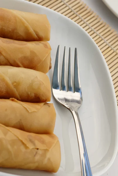 Spring rolls and fork — Stock Photo, Image