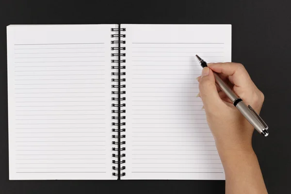 Mão, caneta e caderno — Fotografia de Stock