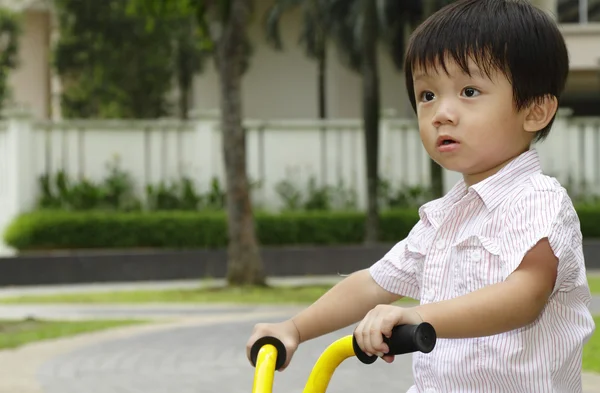 Boy on tricycle — Stock Photo, Image