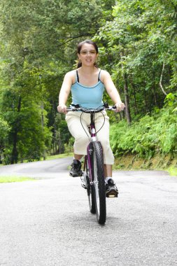 Woman cycling clipart