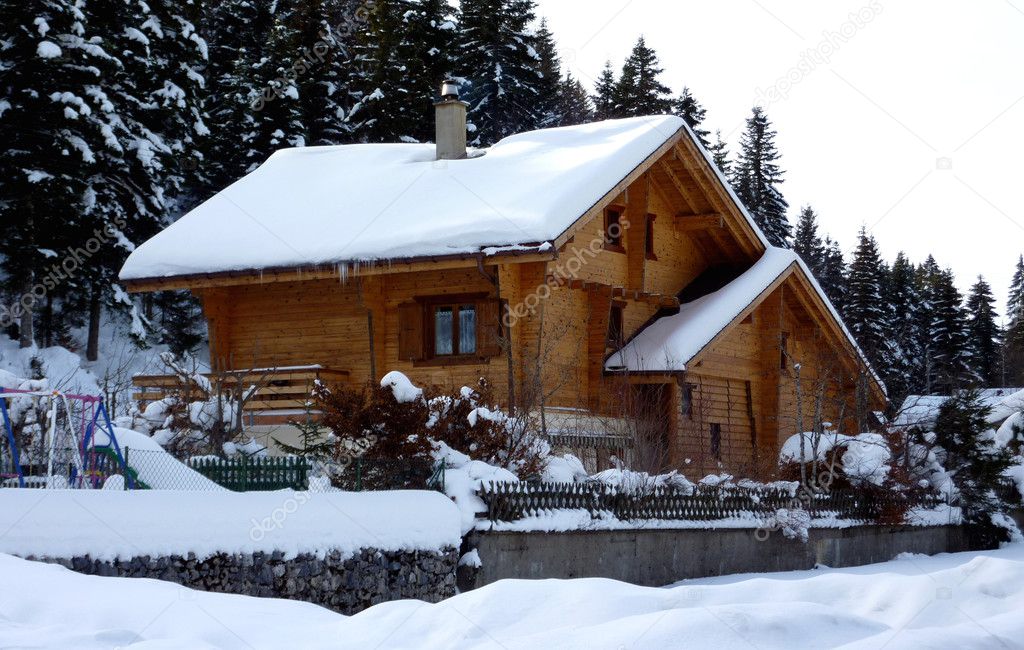 Chalet in Jura mountain by winter