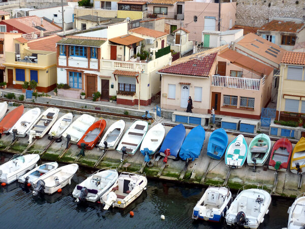 View of the small marina full of small boats and houses at Vallon des Auffes, Marseilles, France