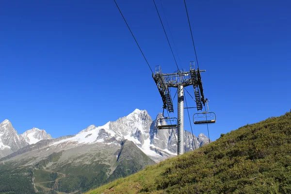 stock image Chair lifts in front of the Mont-Blanc massif, France