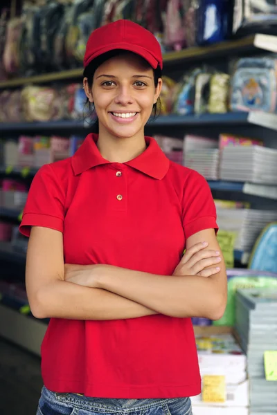 Teenage girl working part time in a stationery s — Stock Photo, Image