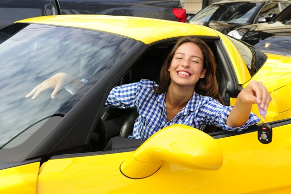 Woman showing keys of her new sports car — Stock Photo, Image