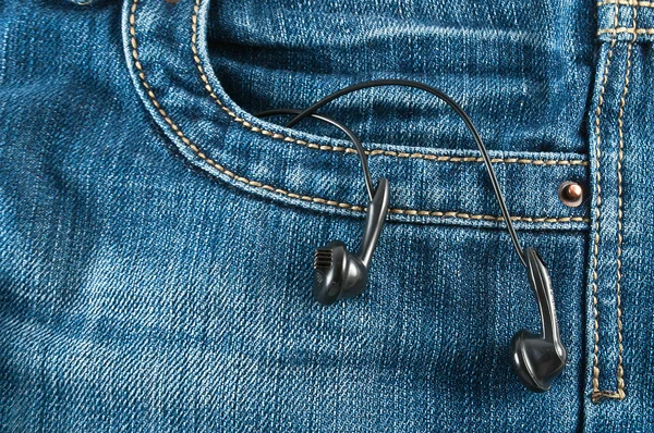 Pocket of jeans with headphone Royalty Free Stock Images