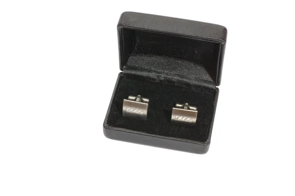 TWO CUFFLINKS IN A WOODEN BOX — 图库照片