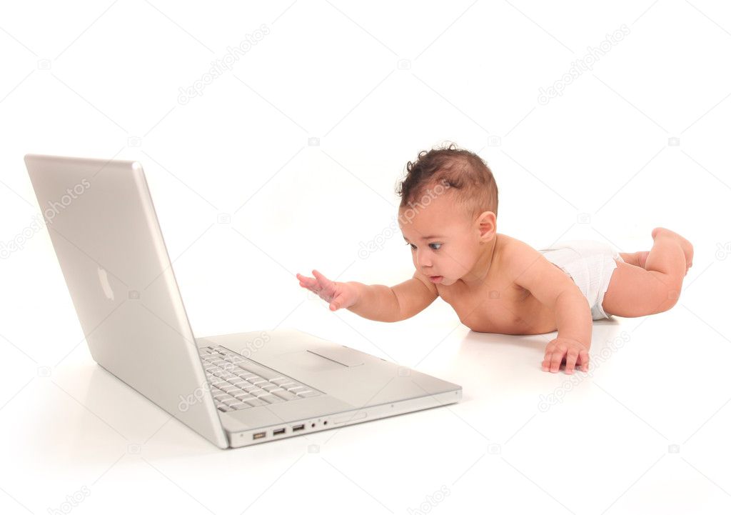 Infant Boy Playing With a Laptop Computer
