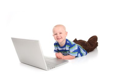 Little Boy Learning to Use a Laptop Comp clipart