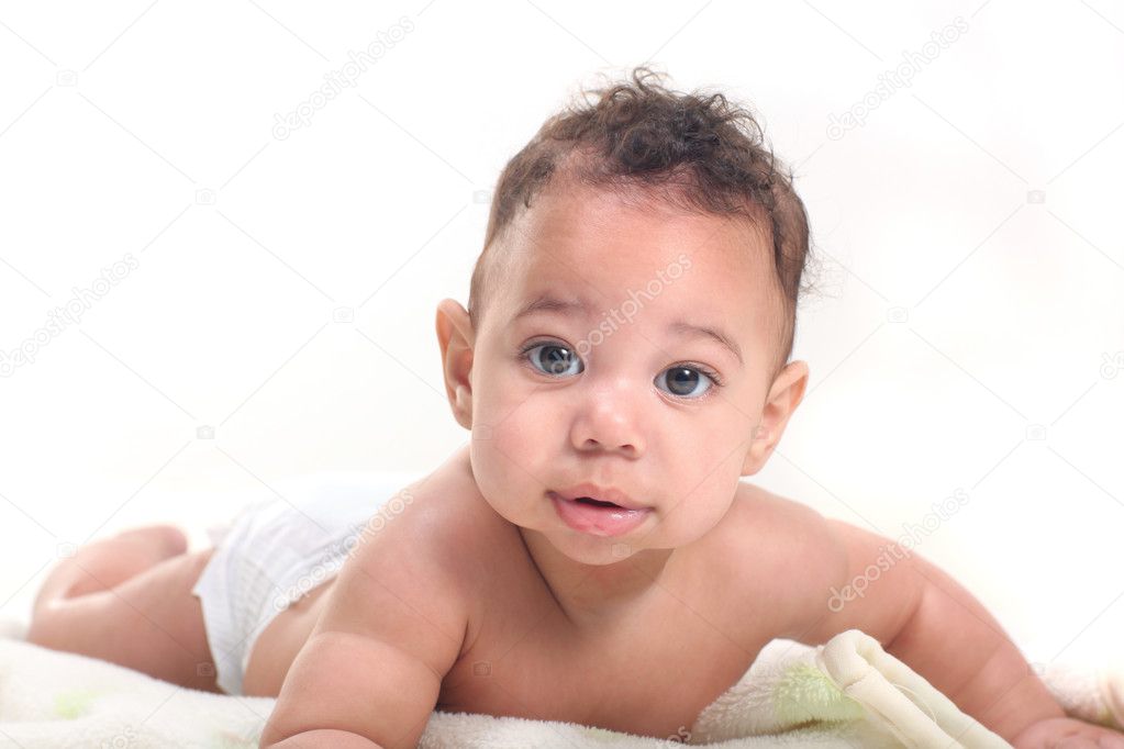 Little Baby Boy Learnign to Crawl on White