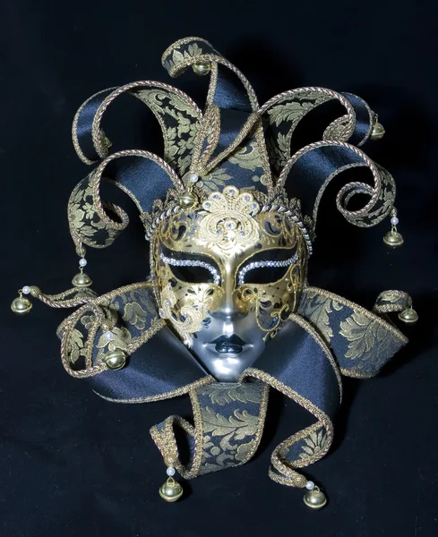 Venezianische Maske auf schwarzem Hintergrund Stockbild
