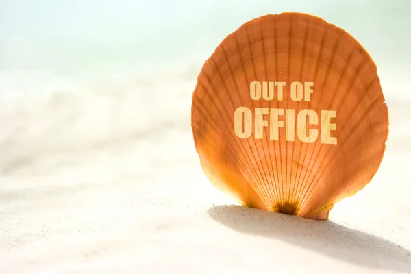 Out of office inscription on shell — Stock Photo, Image
