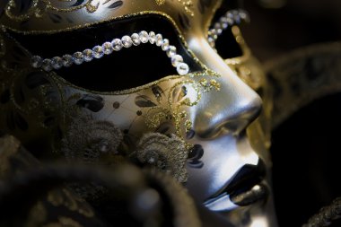 Part of venetian mask on black background