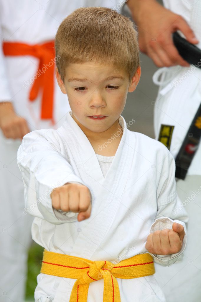 Boy in karate suit training