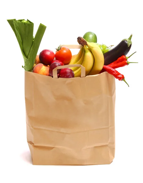 A grocery bag full of healthy fruits and vegetab — Stock Photo, Image