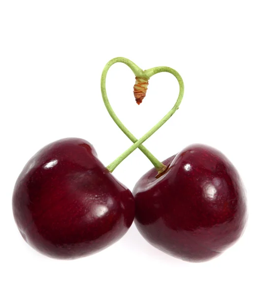 Duas cerejas amarradas juntas em um coração — Fotografia de Stock