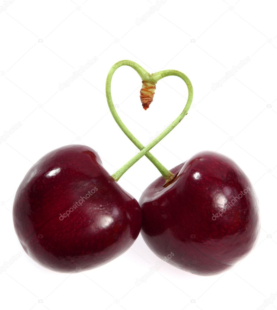 Two cherries tied together in a heart