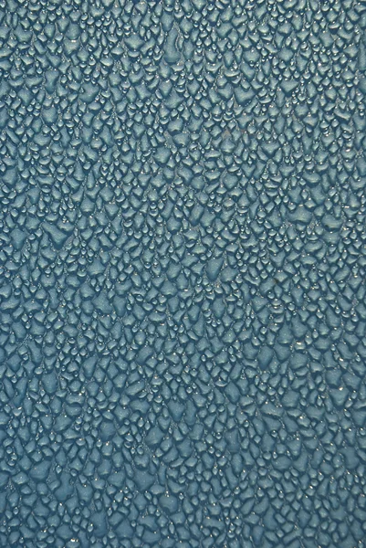 stock image Dew drops on blue metallic surface