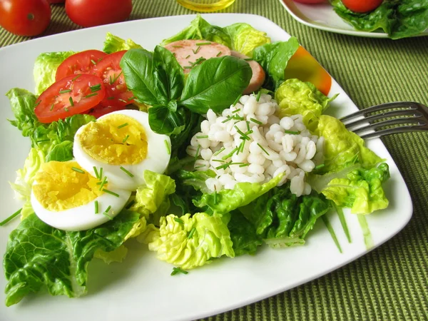 Salad with pearl barley, egg and poultry sausage — Stock Photo, Image