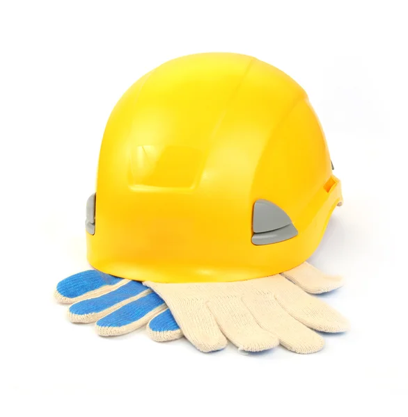 Gele helm en werkhandschoenen — Stockfoto