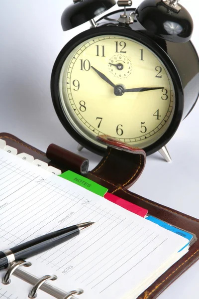 Planner and clock — Stock Photo, Image