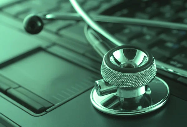 Laptop and stethoscope — Stock Photo, Image