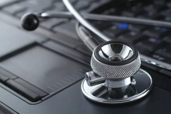 Laptop and stethoscope — Stock Photo, Image