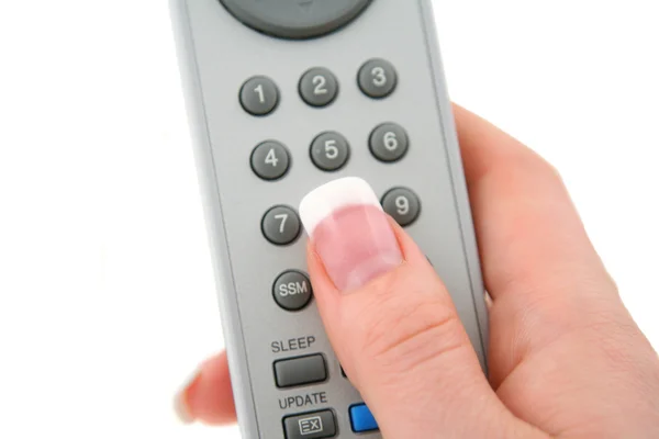 Hand with remote control — Stock Photo, Image