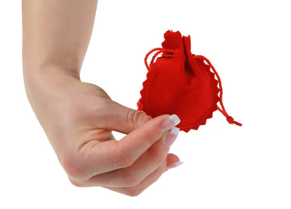 Ręka trzyma czerwony prezent — Zdjęcie stockowe