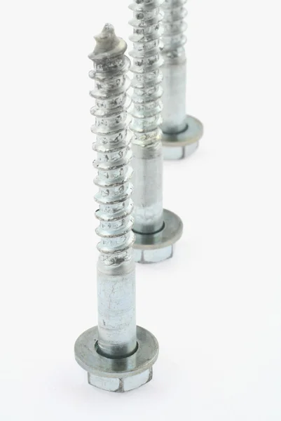 Long screws on white — Stock Photo, Image