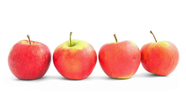 在行中的四个苹果 — 图库照片