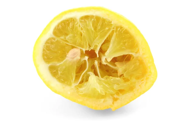 Exprimido limón sobre fondo blanco — Foto de Stock