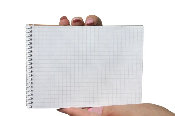 Mãos segurando caderno espiral em branco — Fotografia de Stock