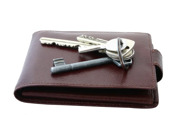 Klucze na brązowy skórzany portfel — Zdjęcie stockowe