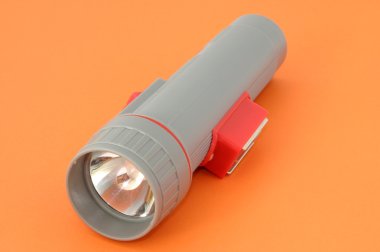 Flashlight on orange clipart