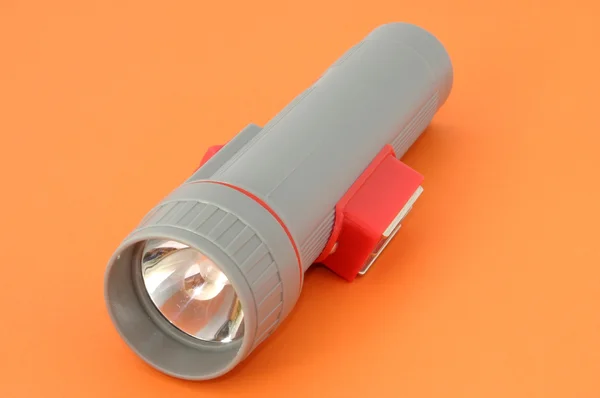 stock image Flashlight on orange