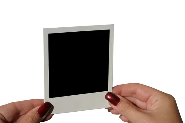 Female hands holding photo frame — Stock Photo, Image