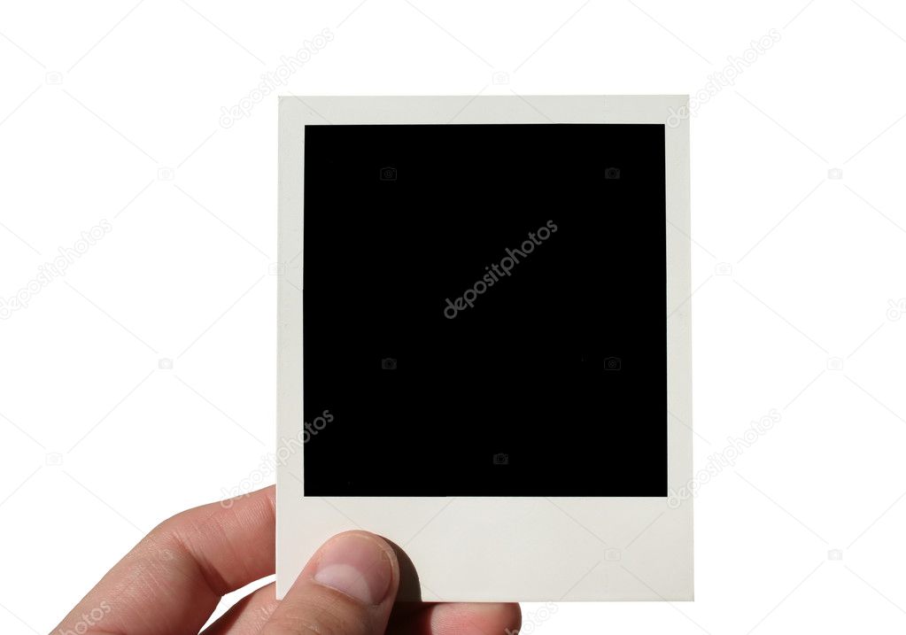 Female hand holding photo frame