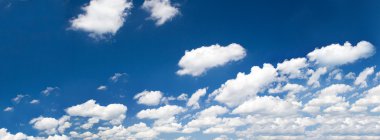 Bright summer sky with cumulus clouds clipart