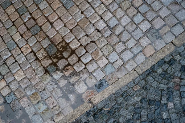 Wet street with puddle — Stock Image Wet street with puddle Stock Photo