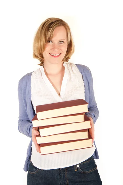 Młoda kobieta z kupą książek — Zdjęcie stockowe