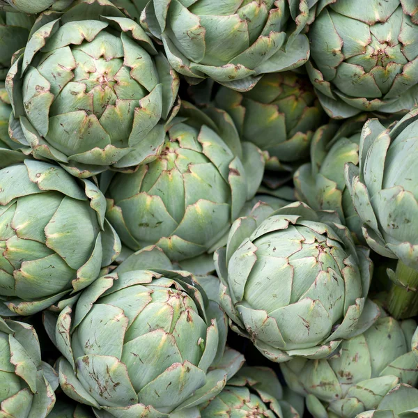 stock image Artichokes at a market