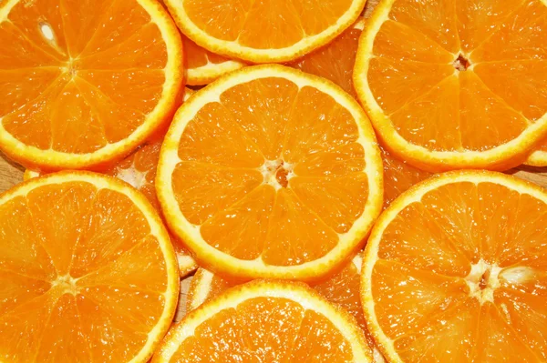 Stock image Background of the sliced orange plastic