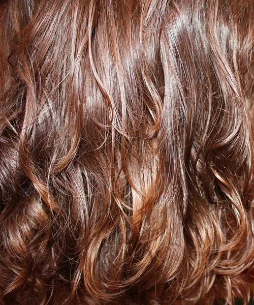 Bakgrund av kastanj vågigt hår — Stockfoto
