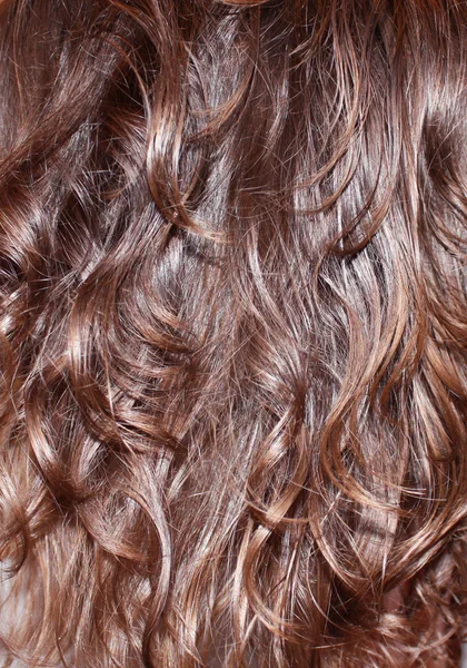 Tło falowane włosy brunetka — Zdjęcie stockowe